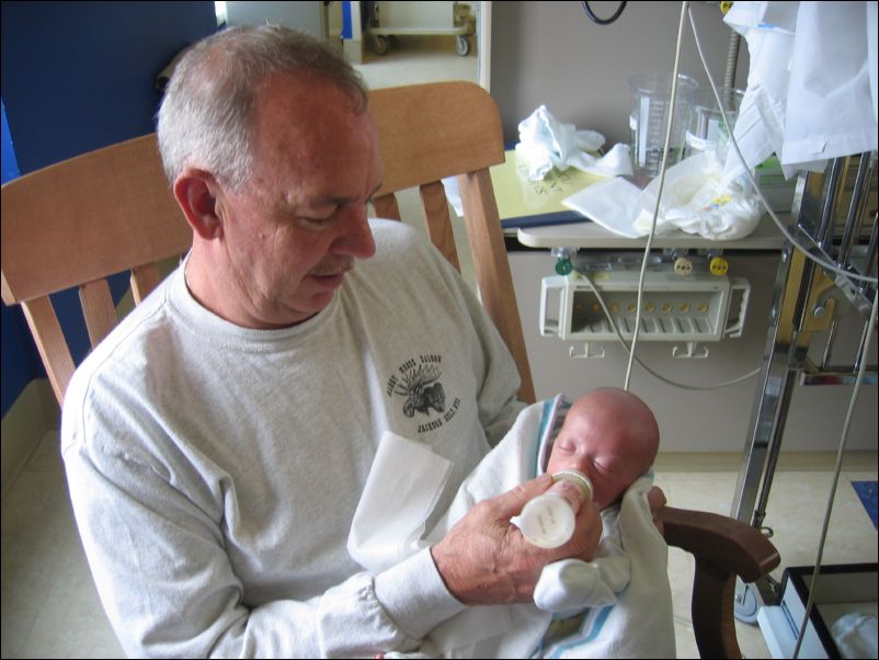 Grandpa feeding Owen